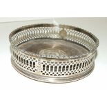 A George III silver wine coaster of circular form with pierced border, maker Robert Hennell 1,