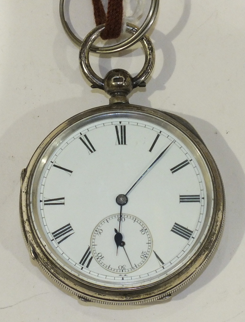 A Victorian open face keywind pocket watch, the white enamel dial with Roman numerals and seconds