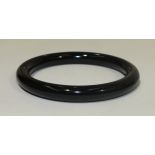 An onyx bangle, inside diameter 6cm.