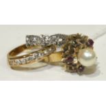 A gold ring set pearl and ruby cluster, (one ruby setting vacant), in unmarked mount, (tests as