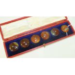 A set of six agate buttons in fitted box, each button 2.5cm diameter.