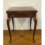 An early 20th century walnut envelope card table on cabriole legs, 62cm closed, 119cm open.