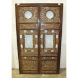 A late 19th/early 20th Chinese hardwood screen, the rectangular frame enclosing fourteen profusely