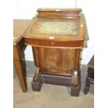 A Victorian walnut cross-banded Davenport desk, 53cm wide, on later stained wood plinth.