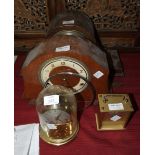 A brass Kundo 400-day clock under glass dome, 18cm high, two wood cased chiming mantel clocks and