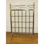 A brass firescreen with rectangular leaded light panel, 58cm wide, 86cm high and a brass and iron