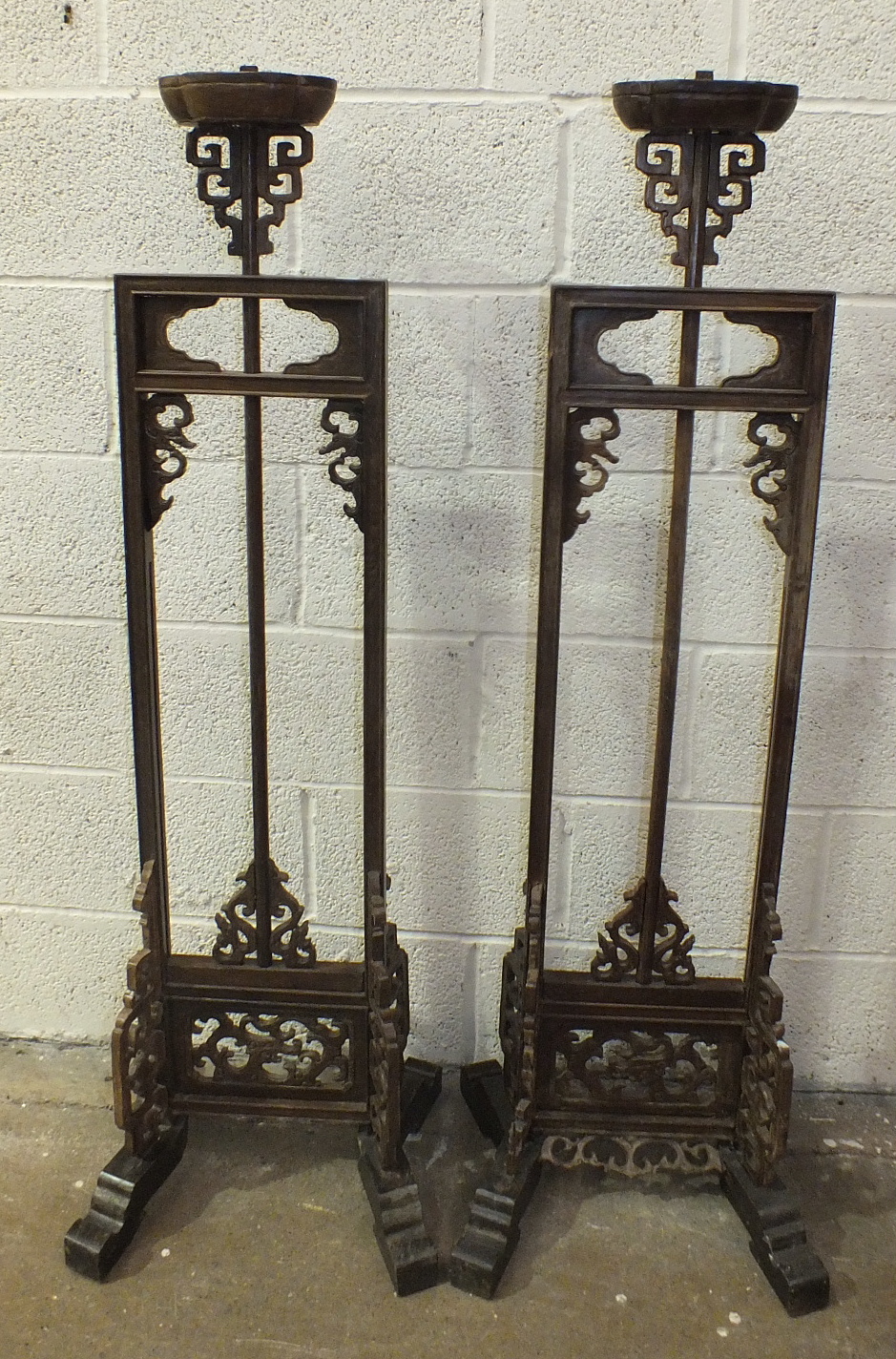 A pair of Chinese carved hardwood adjustable lamp stands, 137cm high, 188cm maximum, (one with