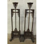 A pair of Chinese carved hardwood adjustable lamp stands, 137cm high, 188cm maximum, (one with