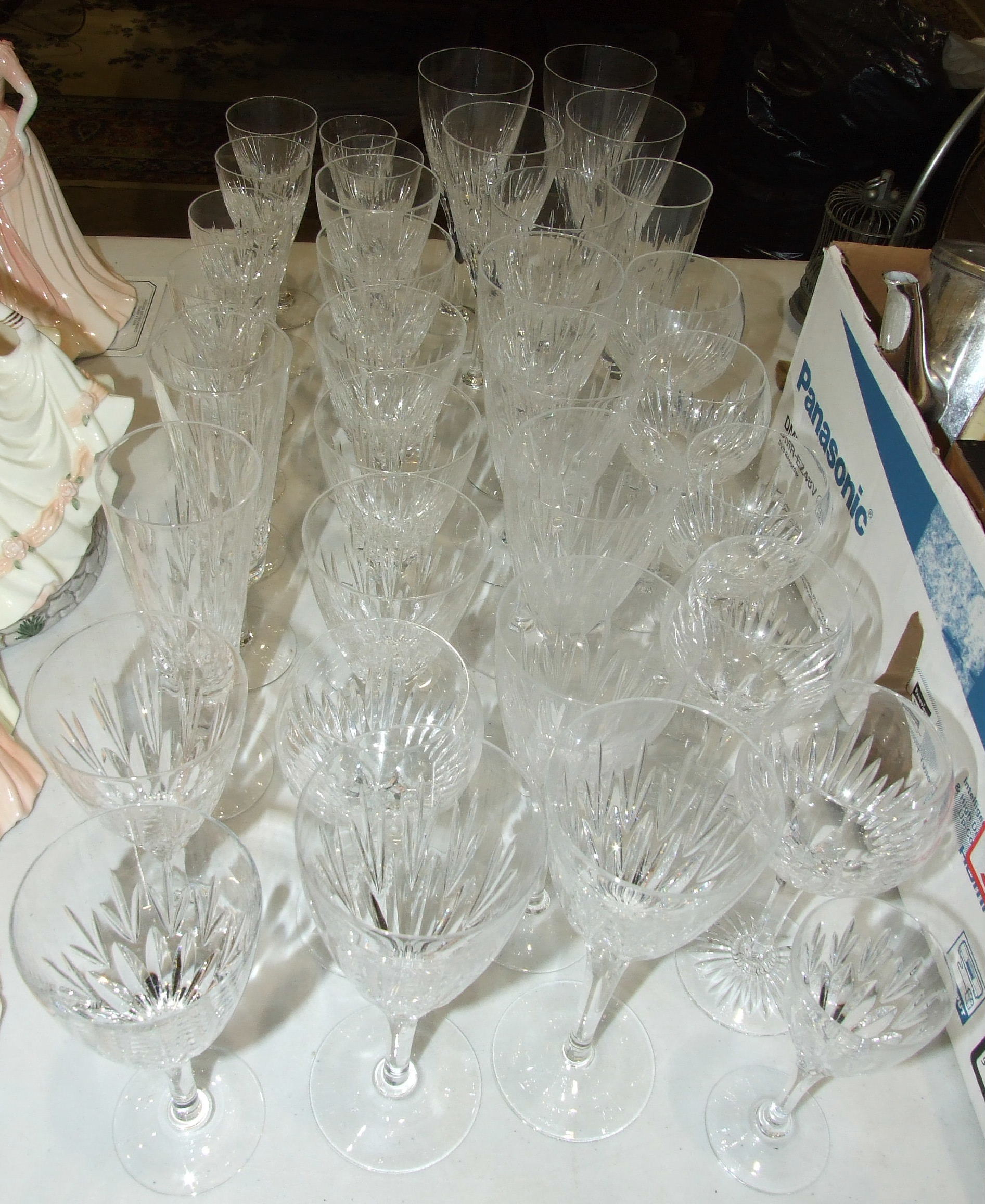 A collection of cut glass wine and port glasses, approximately 35 pieces.