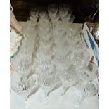 A collection of cut glass wine and port glasses, approximately 35 pieces.