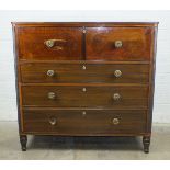 An early 19th century secretaire chest in two parts, the top with reeded edge above a fitted