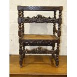 A pair of carved wood stools with twist legs and carved stretchers, 60cm wide, (2).