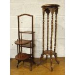 An Edwardian walnut plant stand on twist support, 29cm diameter, 103cm high, and a folding four-tier