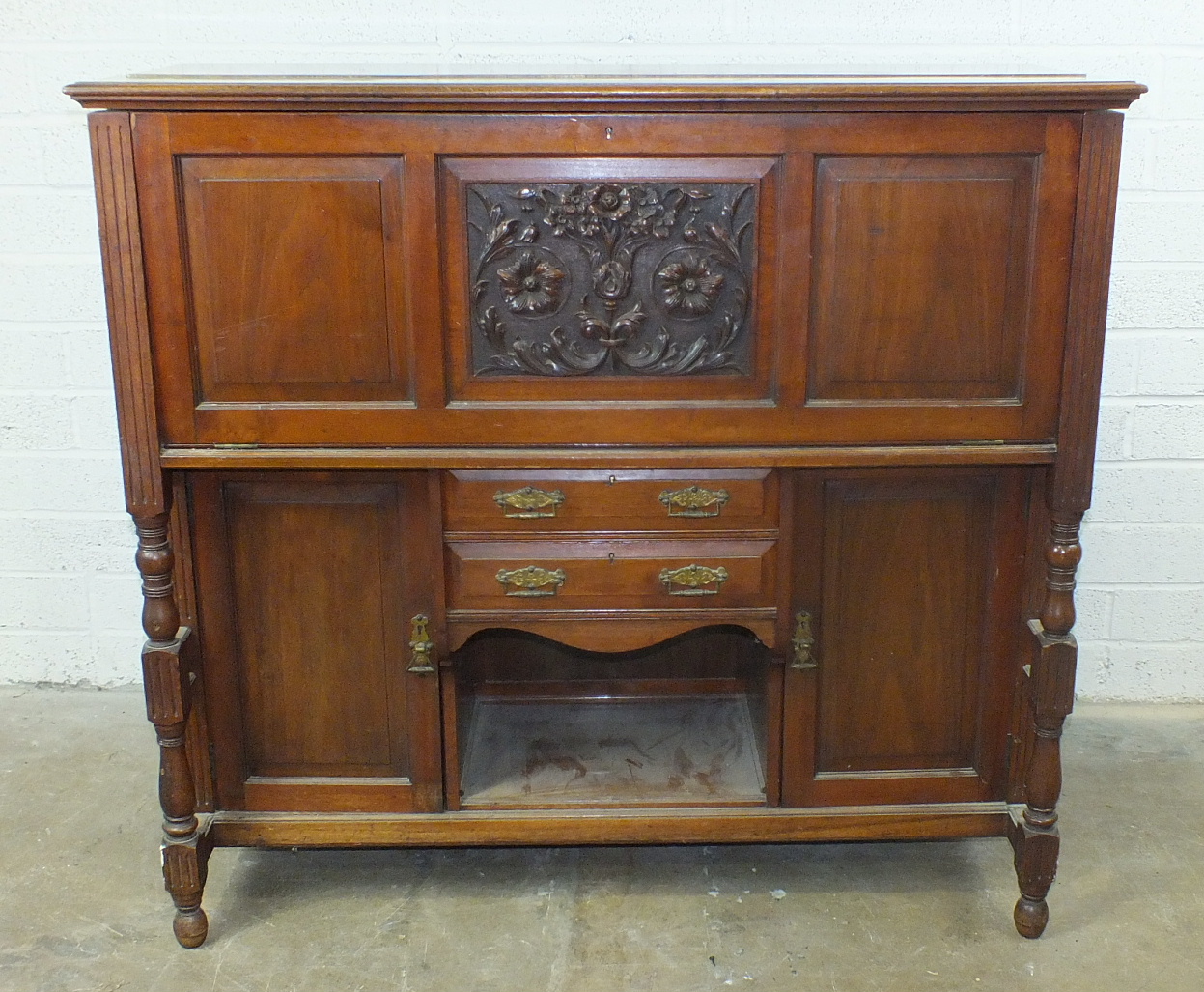 A Victorian walnut enclosed writing desk, the hinged top and drop-down front, the fully fitted
