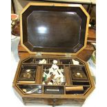 A Victorian octagonal lacquered work box having overall chinoiserie decoration, concealed drawer,