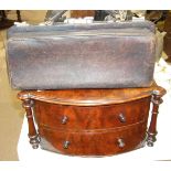 A small leather Gladstone bag, 41cm wide, possibly for medical use, and a mahogany two-drawer
