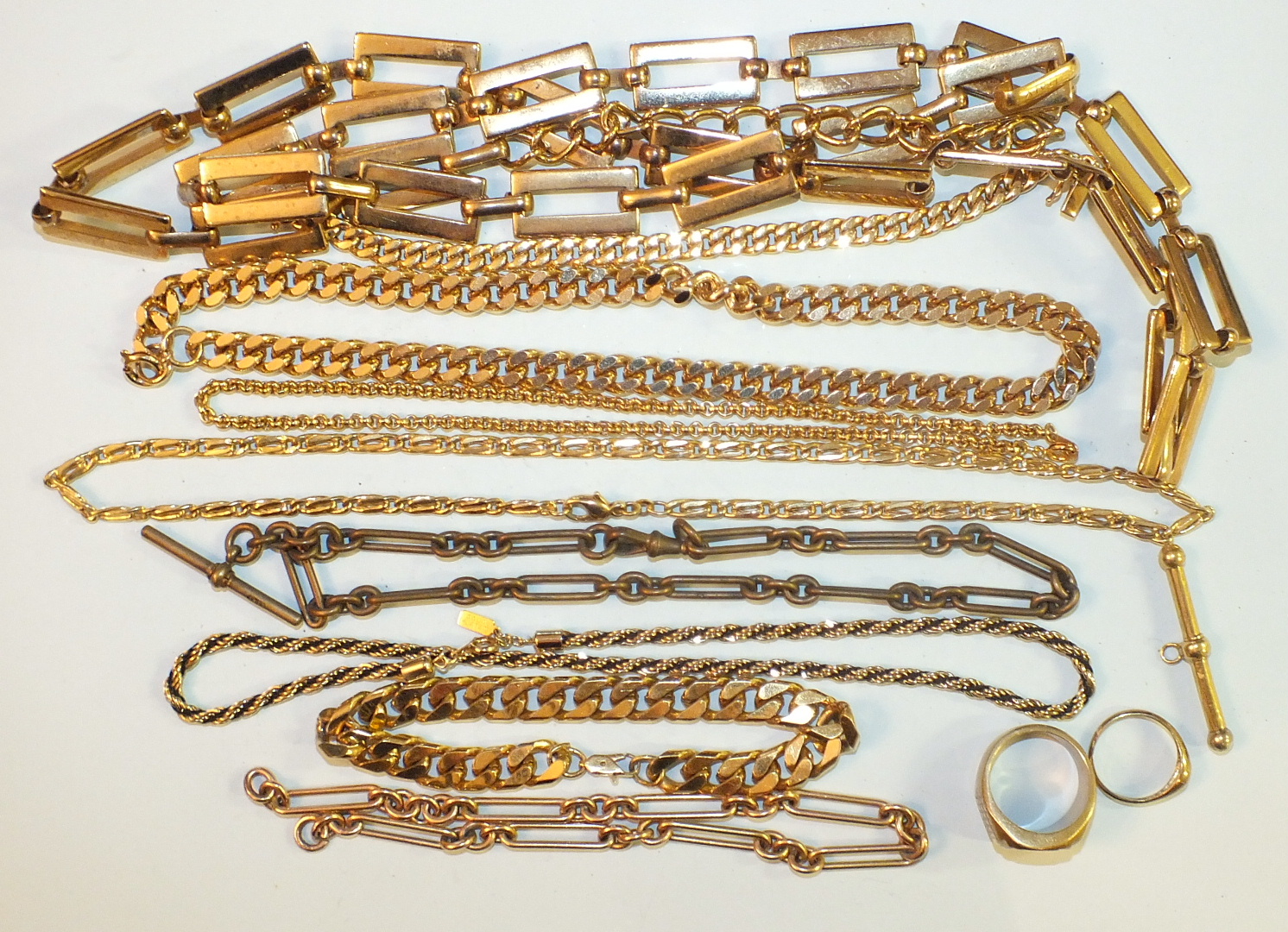 A quantity of yellow metal and plated jewellery.