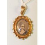 An 18ct gold oval pendant inset a miniature of a young woman, 23 x 18mm, 3.5g.