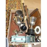 An aneroid barometer on wooden mount, various plated trophy cups and other items.