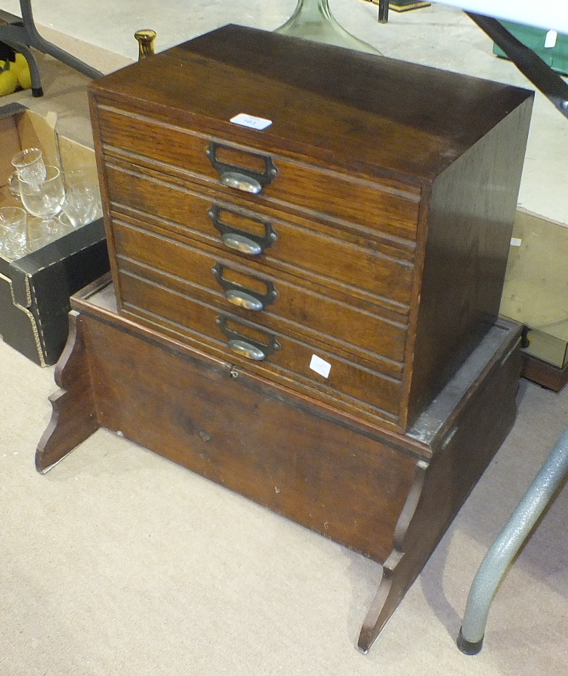 A set of four oak filing drawers, 42cm wide, 32cm high.