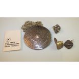 A Danish silver ring by John Lauritzen, a large disc pendant by John Rimer and a pair of Swedish