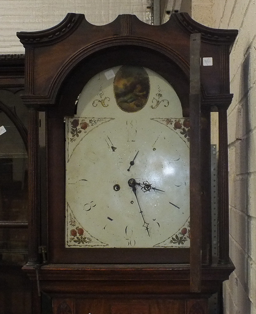 A late 18th/early 19th century long case clock, the painted dial signed "M Godfrey *****minster",