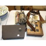 A backgammon board, a Sam Browne belt, a painted metal milk churn and other items.