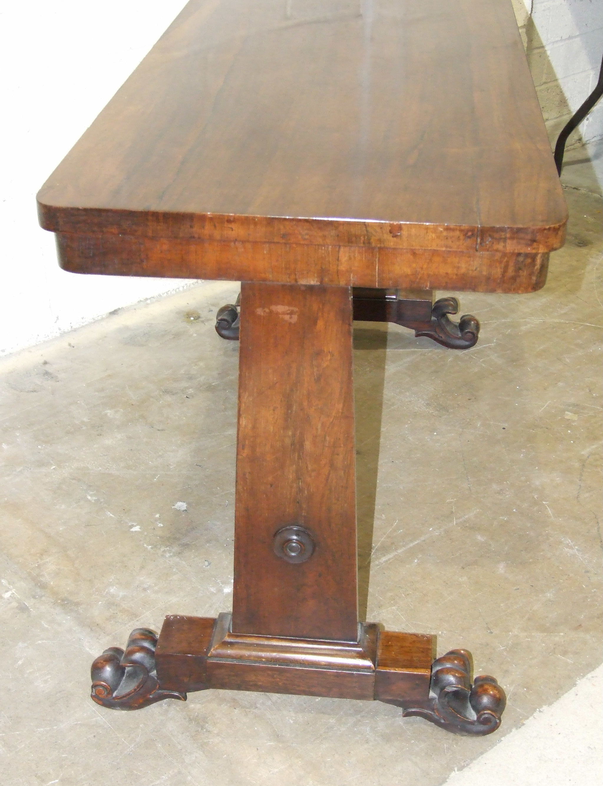 A William IV rosewood centre table, the rectangular top raised on tapered end supports with carved - Image 2 of 2