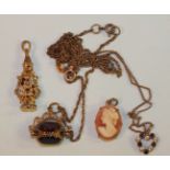 A 9ct gold articulated clown pendant set garnets and white stones, 2.2g, a small 9ct gold swivel-fob