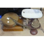 A Victorian copper saucepan and lid with iron handles, and other items.