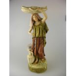 A large Royal Dux Figurine of a lady balancing a basket on her head