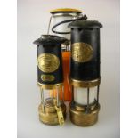 A Thomas and Williams Cambrian railway lanterns together with one smaller and a modern Primus