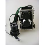A Mamiya C3 Professional Camera together with Mamiya removable double lens