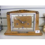 An Enfield Art Deco style clock, with presentation plaque 1938.