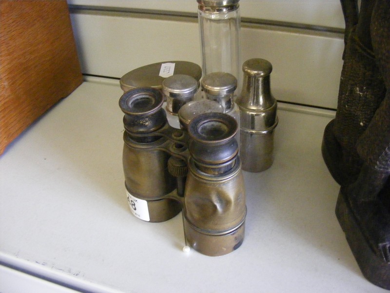 A pair of vintage brass binoculars (examine) together with some plated topped toilet jars