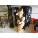 3 carved ethnic statues together with face mask