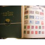 Two Green albums containing a quantity of world stamps