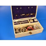 A jewellery box containing a quantity of costume jewellery to include rings, bracelets,necklaces,