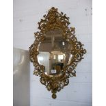 Rocco style gilt metal wall mirror