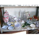 Two shelves of assorted ceramics and glassware