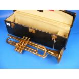 A cased brass trumpet Honner