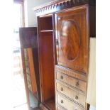 A mahogany compactum wardrobe with four fitted drawers with long mirrored door (not attached)