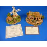 A Lilliput lane cottage boxed together with one other similar