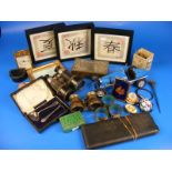 A carton of assorted curios and collectable items to include binoculars,