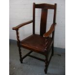 A good size oak elbow chair on barley twist legs