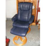 A leather easy chair and stool