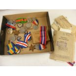 A selection of WW2 medals together with badges, paybook,