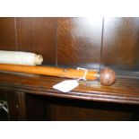 A vintage gentleman's walking cane together with a silk picture on roll