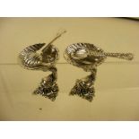 A pair of silver dolphin fish shell salts and spoons