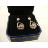 A 9K 7 diamond daisy drop earrings